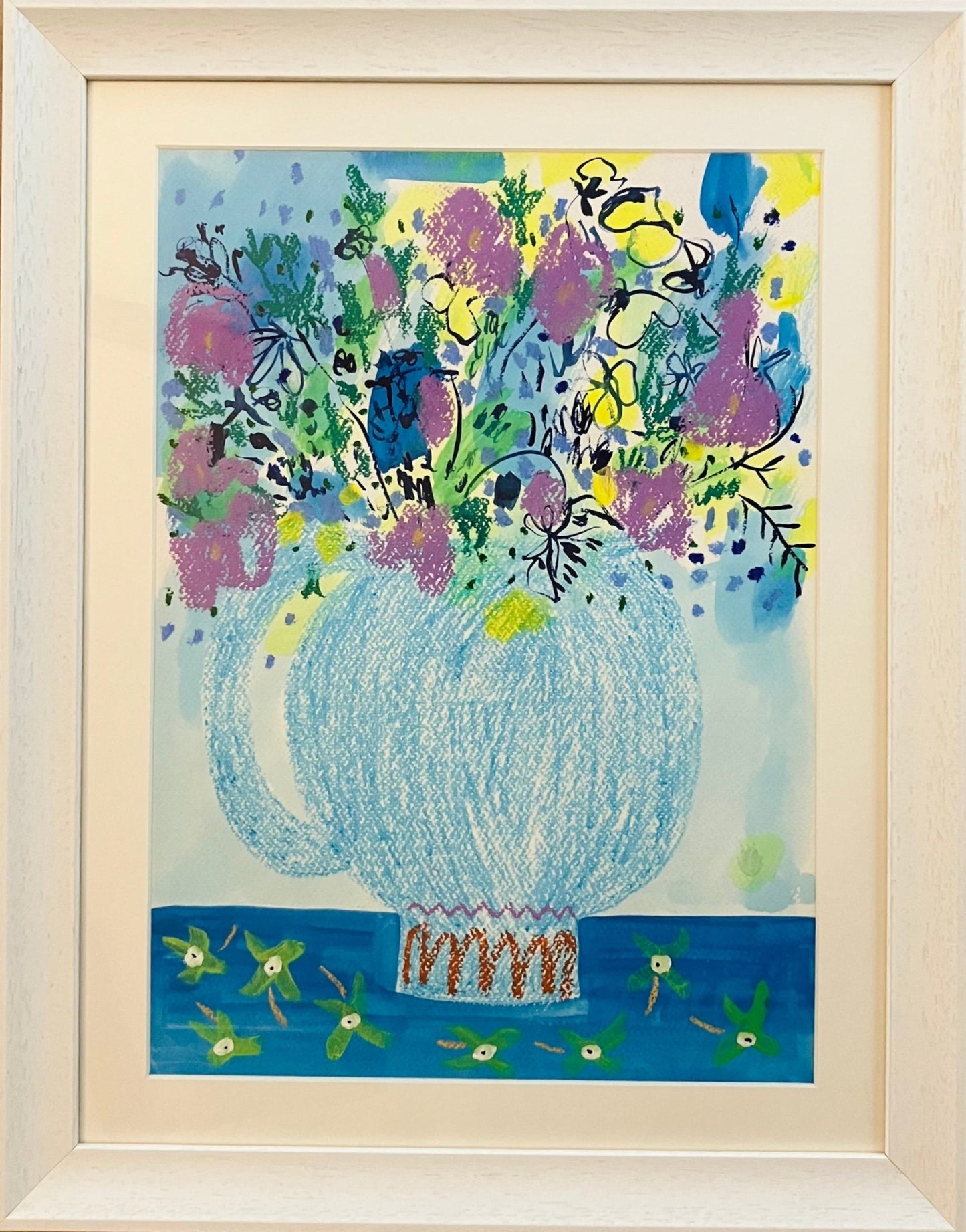 A framed artwork featuring a colorful floral arrangement in a white vase, with a mix of blue, green, yellow, and pink hues, set against a white background.